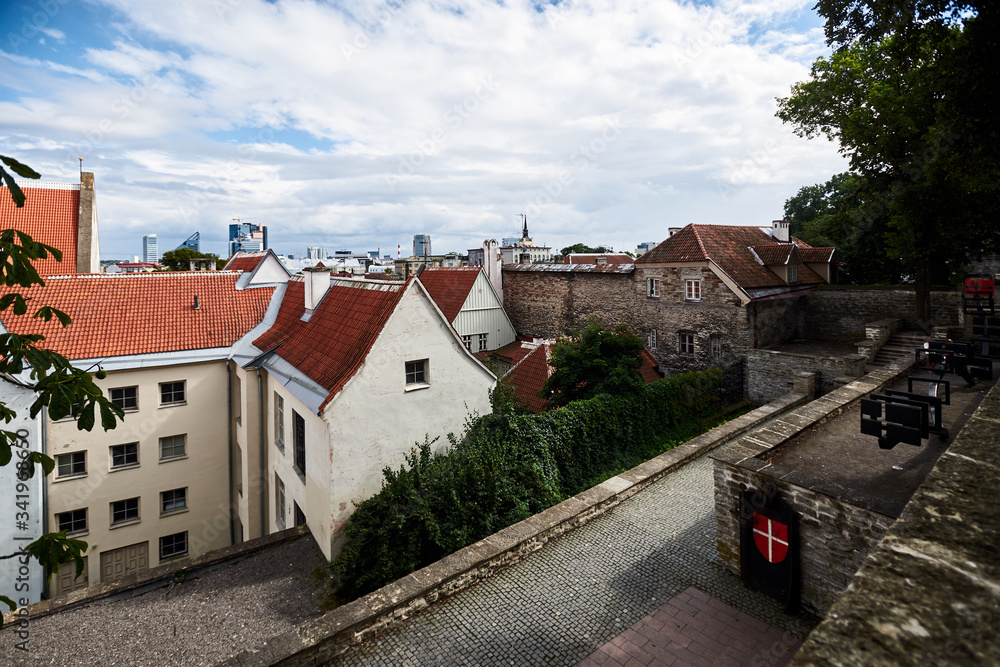 center of an old European city with stone walls and red tiled roofs on a sunny day. with steps and different tiers. center of an old European city with stone walls and red tiled roofs on a sunny day. with steps and different tiers.