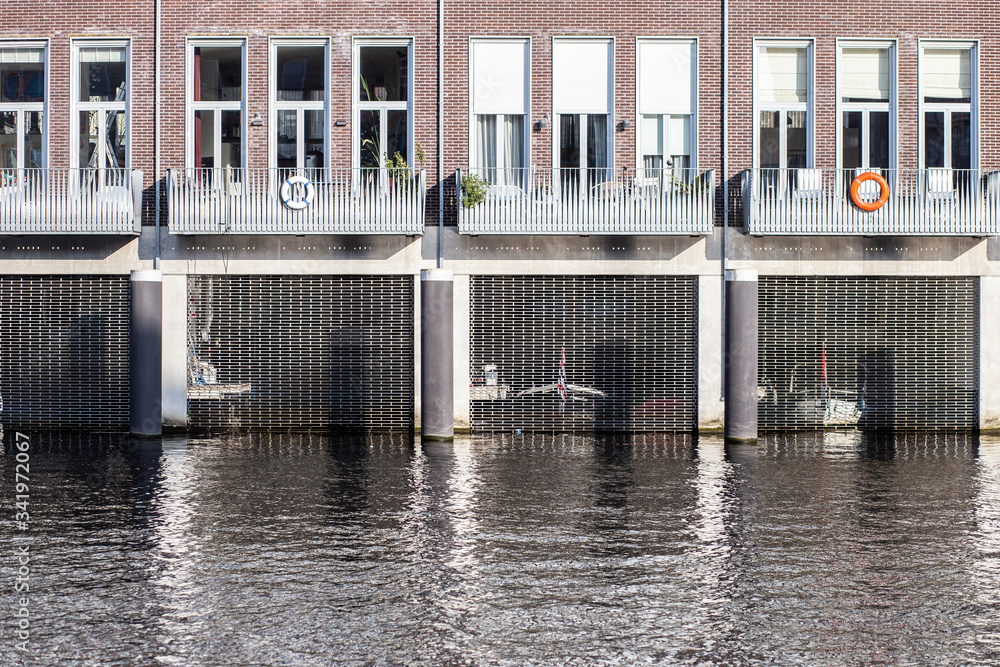 modern canal house in Amsterdam with a garage for boats modern canal house in Amsterdam with a garage for boats