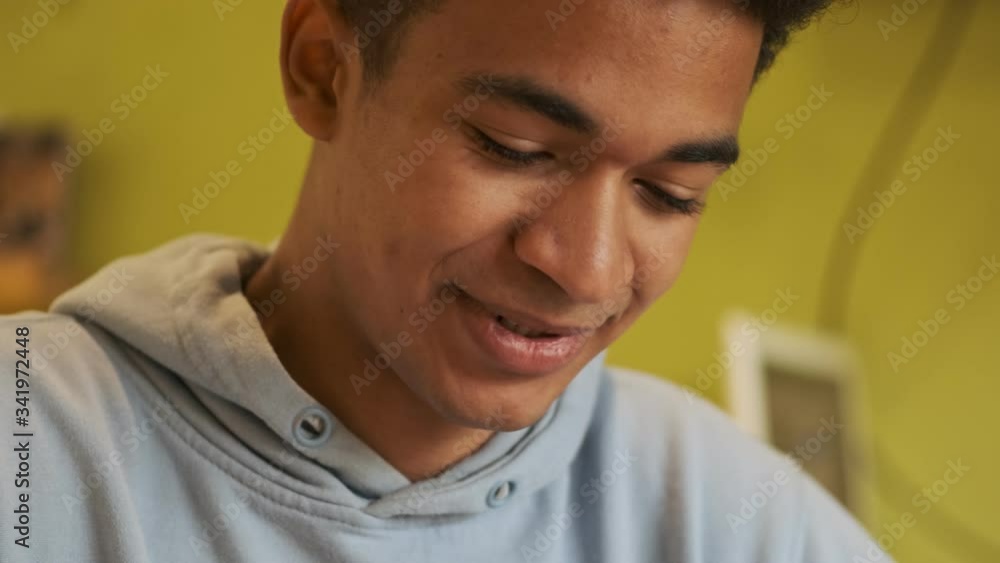 Closeup of concentrated handsome positive african guy indoors. Closeup of concentrated handsome positive african guy indoors.