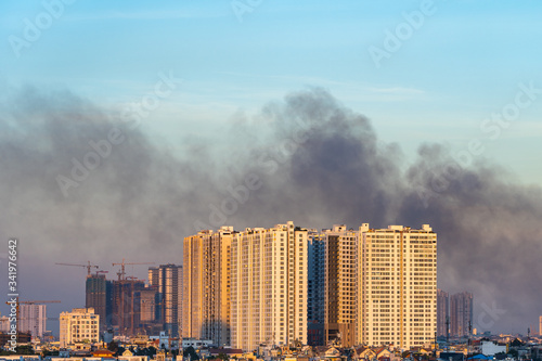 Scenery of polluted city with dark smoke from factory chimneys