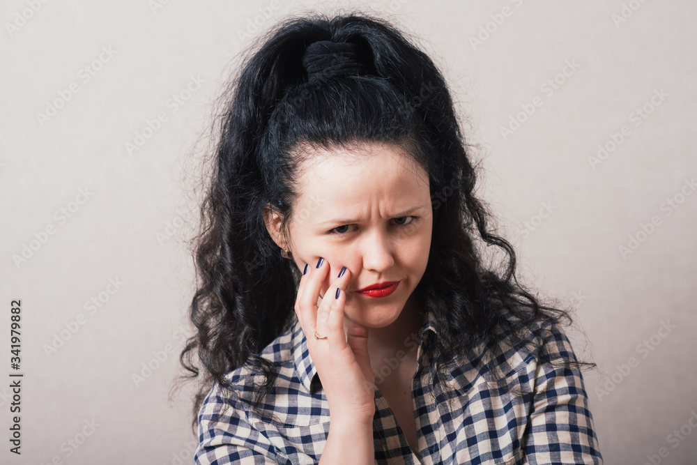 woman with distrust looks to side woman with distrust looks to side