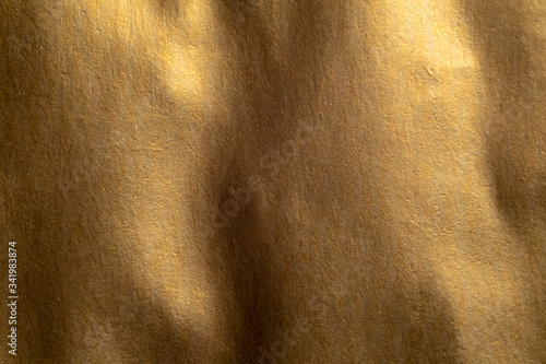 Macro shot of golden paper texture.