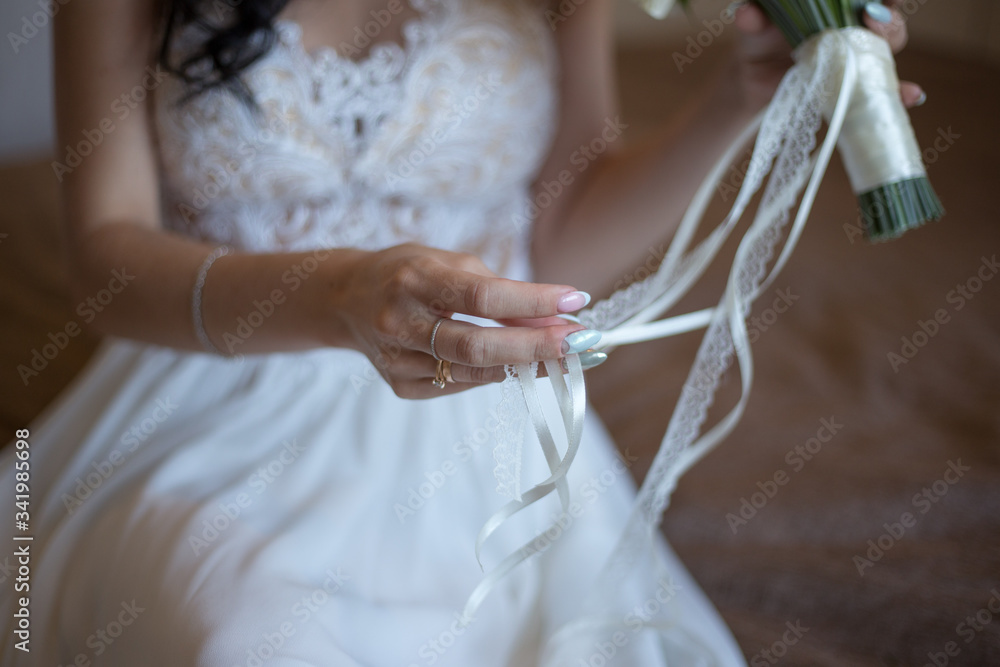 bride holds a wedding bouquet