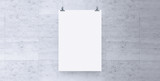 Blank white paper hanging on brick wall. Poster clips empty template mockup.