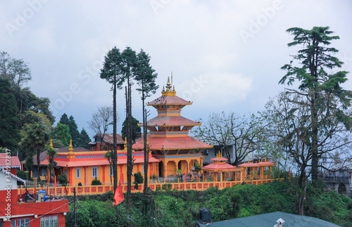 Monastery in the mountains among green trees and mountains. India Sikkim photo