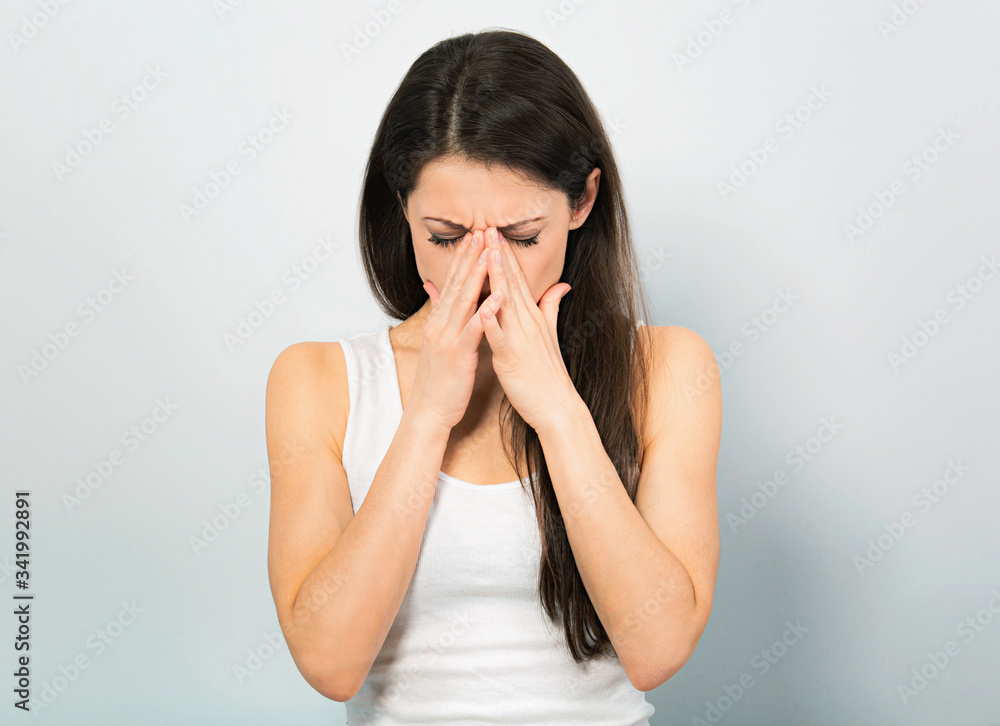 Crying young woman covering the face the hands and find the solution on problem situation. Corona virus. Working at home. Studio portrait Crying young woman covering the face the hands and find the solution on problem situation. Corona virus. Working at home. Studio portrait