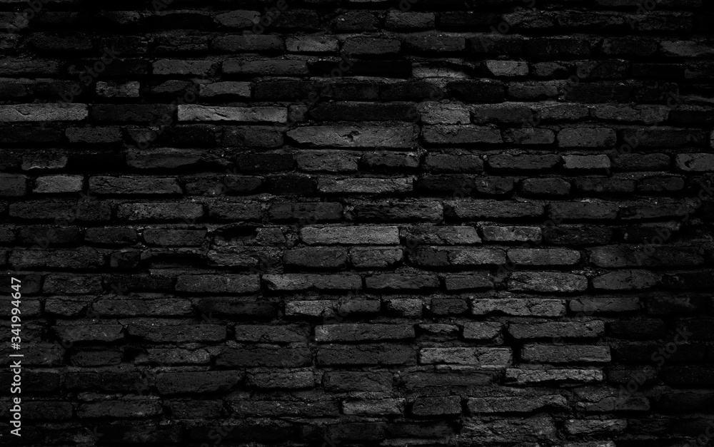Old black brick wall texture background, black stone block wall texture, rough and grunge surface