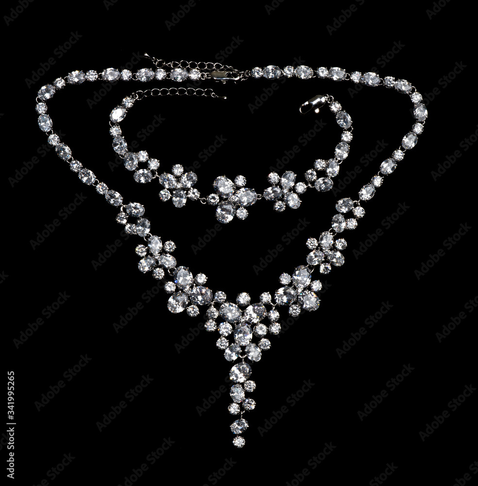 Necklace with precious stones diamonds on a black background Necklace with precious stones diamonds on a black background