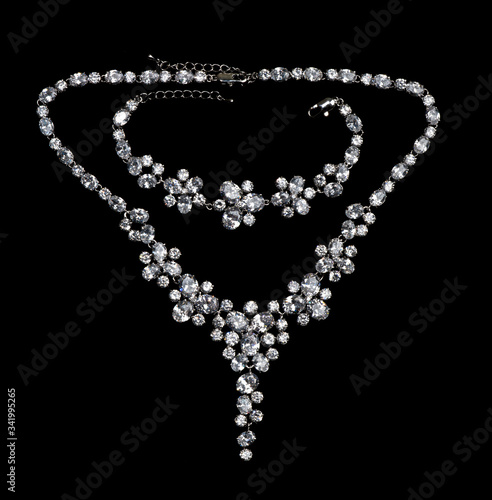 Necklace with precious stones diamonds on a black background
