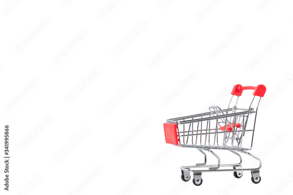 A Shopping Cart. Mini shopping trolley, isolated on white background. Mini Shopping Cart On The Table. Business , e-commerce concept. A Shopping Cart. Mini shopping trolley, isolated on white background. Mini Shopping Cart On The Table. Business , e-commerce concept.