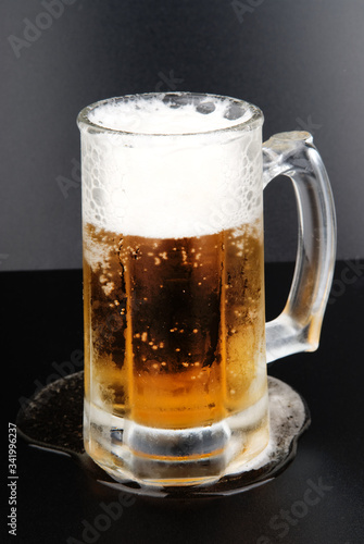 Glass with beer on a black background