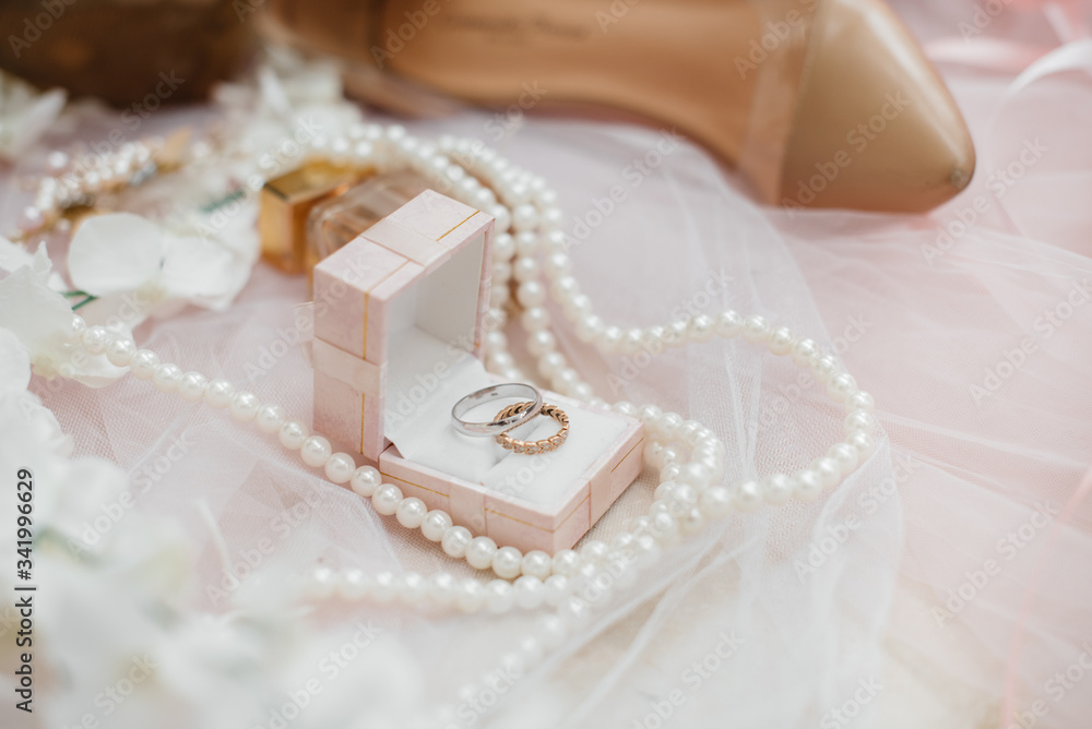 Wedding rings and other accessories close-up during the bride's gathering. Wedding Wedding rings and other accessories close-up during the bride's gathering. Wedding