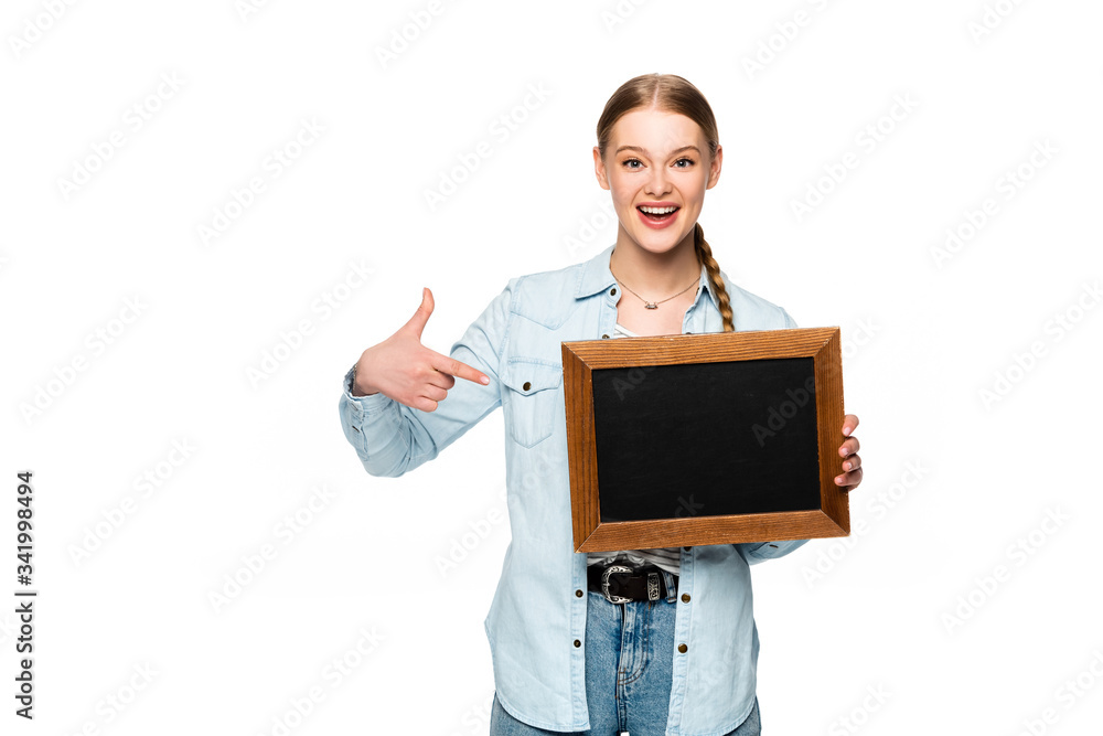 smiling pretty girl with braid pointing at empty chalkboard isolated on white smiling pretty girl with braid pointing at empty chalkboard isolated on white