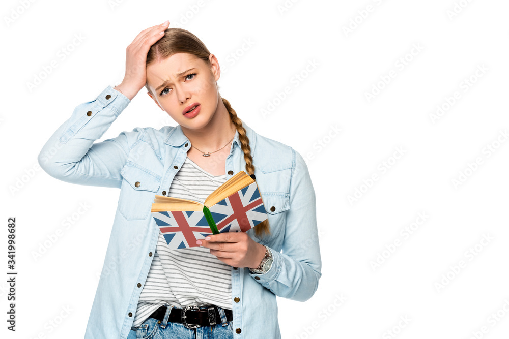 tense pretty girl with braid reading book with uk flag and touching head isolated on white tense pretty girl with braid reading book with uk flag and touching head isolated on white