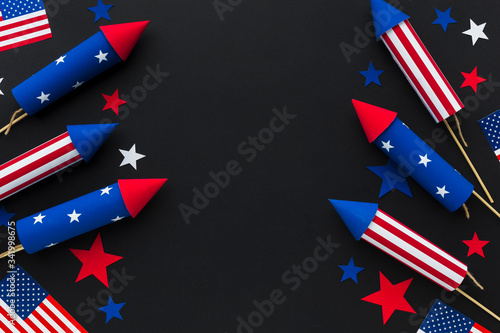 Top view of independence day fireworks with stars and american flags photo