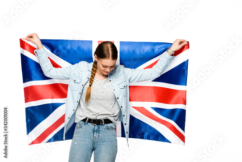pretty girl with braid holding uk flag isolated on white