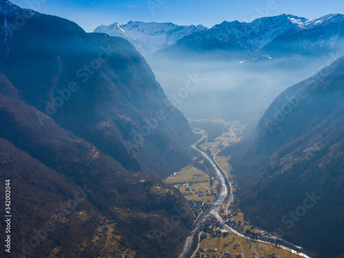 aerial view on Maggia valley in Ticino with snowcapped mountains photo