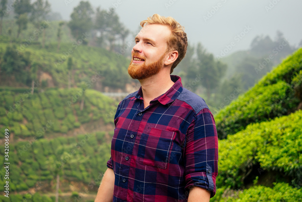 redhaired ginger male enjoying morning in India chai plantations Munnar redhaired ginger male enjoying morning in India chai plantations Munnar