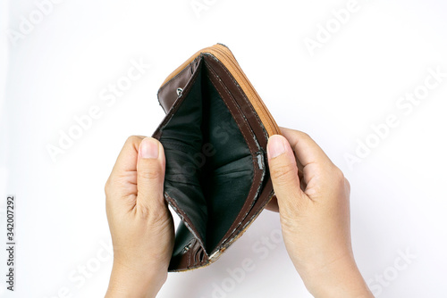 Hand open old empty wallet or purse no money on white background 