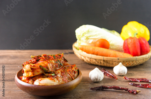 Traditional Korean Kimchi in a bowl on wooden background, top view, Korean food ,Korean food traditional cuisine. Fermented food. Vegetarian food good for health, Vegan for weight control diet