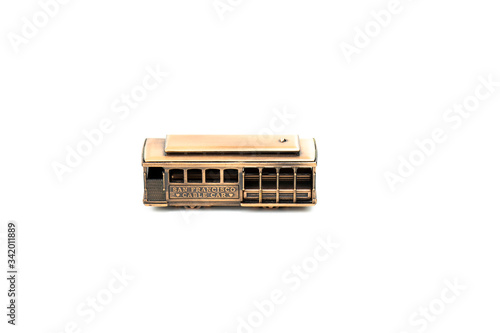 Photography die cast toy san francisco cable car isolated on white background metal model souvenir from USA, copper tram car figurine, symbol of san francisco