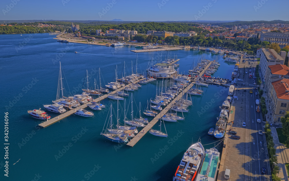 PULA, CROATIA - SEPTEMBER 13, 2019: Aerial shoot of Pula harbor and marina with boats and sailboats, Adriatic tourist destination Pula, Croatia.