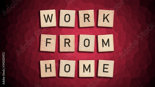 Work from home written with wooden tiles over red background
