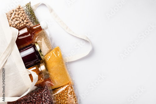 Healthy vegan food supplies of cereal, legumes on white background with copyspace. Vegetable protein.