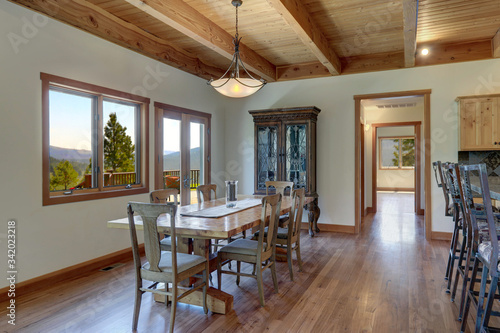 Photography Classic country home in American Cascade mountains dining room interior with antique furniture