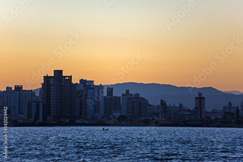 Row of buildings on the coast of Florianópolis at sunset, Santa Catarina, Brazil
