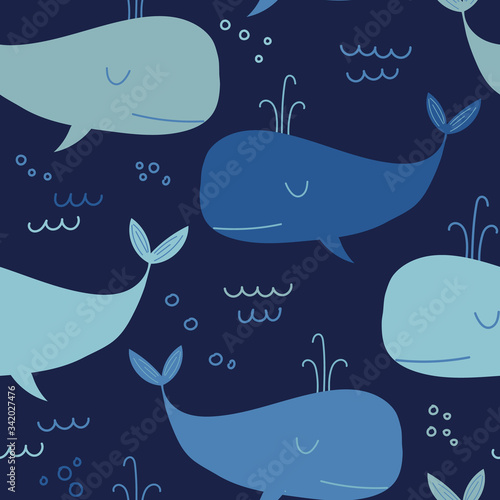 Seamless pattern with cute blue whales.Vector children's illustration isolated on a dark blue background.It can be used as a design for children's clothing, bed linen, stationery, packaging paper.
