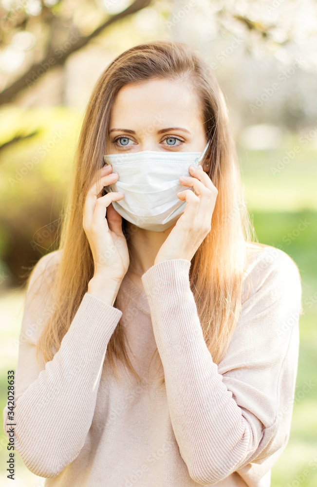 Woman wearing protective mask outdoor during coronavirus outbreak. Woman wearing protective mask outdoor during coronavirus outbreak.