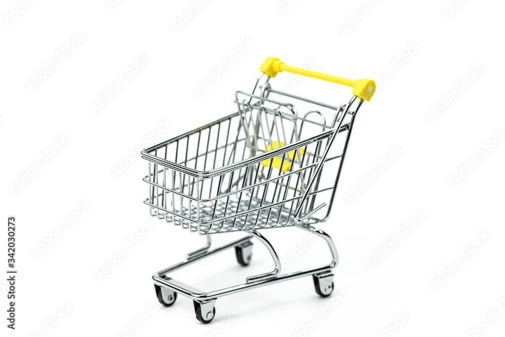 Empty supermarket cart isolated on white background - symbol of consumerism, consumer society. conscious consumption trend
