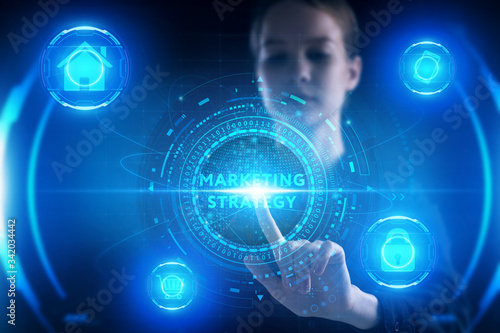 Business, Technology, Internet and network concept. Young businessman working on a virtual screen of the future and sees the inscription: marketing strategy