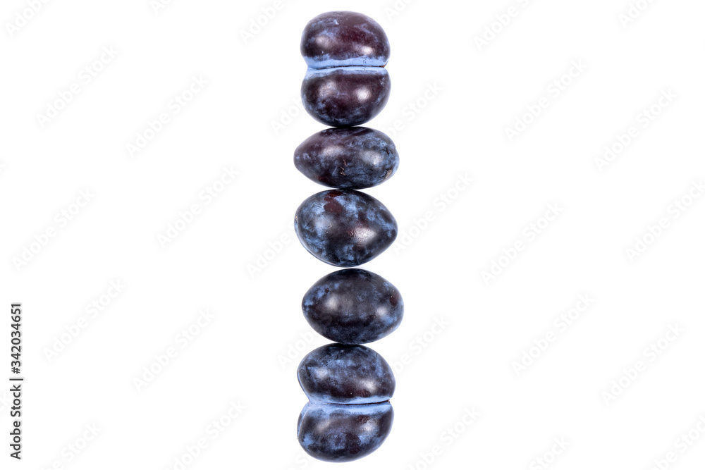 Fresh blue plums, isolated on white background, in close-up. Fresh blue plums, isolated on white background, in close-up.