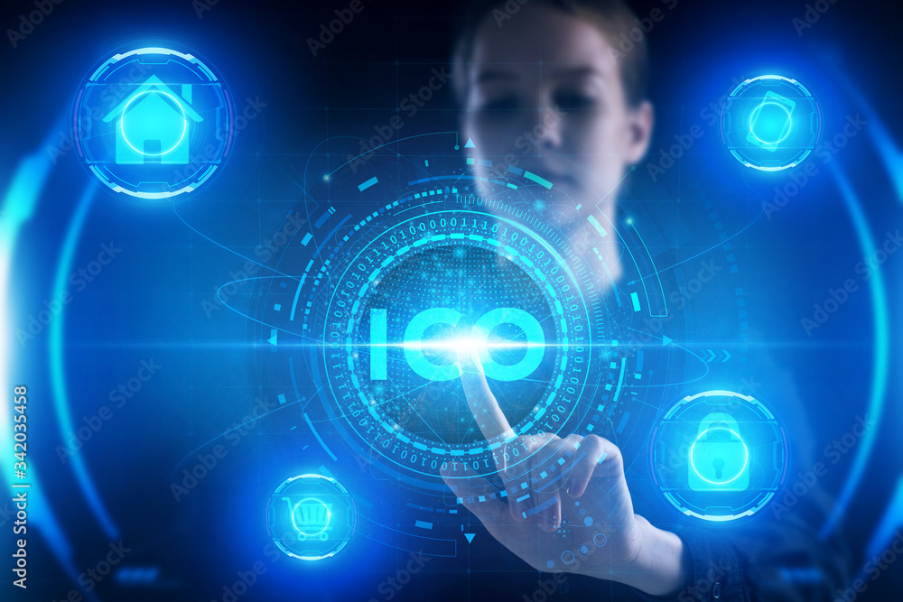 Business, Technology, Internet and network concept. Young businessman working on a virtual screen of the future and sees the inscription: ICO Business, Technology, Internet and network concept. Young businessman working on a virtual screen of the future and sees the inscription: ICO