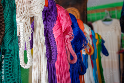 Colorful Hammocks hanging in Cancun Local Fair. These Mayan hammocks are fresh and comfortable to sleep in. They are hand made by local Mayan communities.
