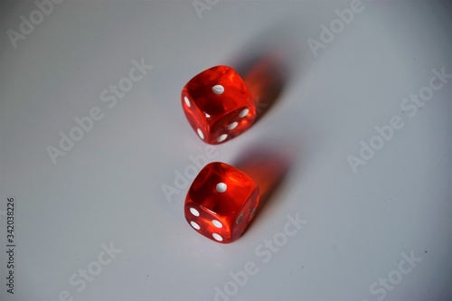 Fotografie Red pair of dice on white background with number one facing up