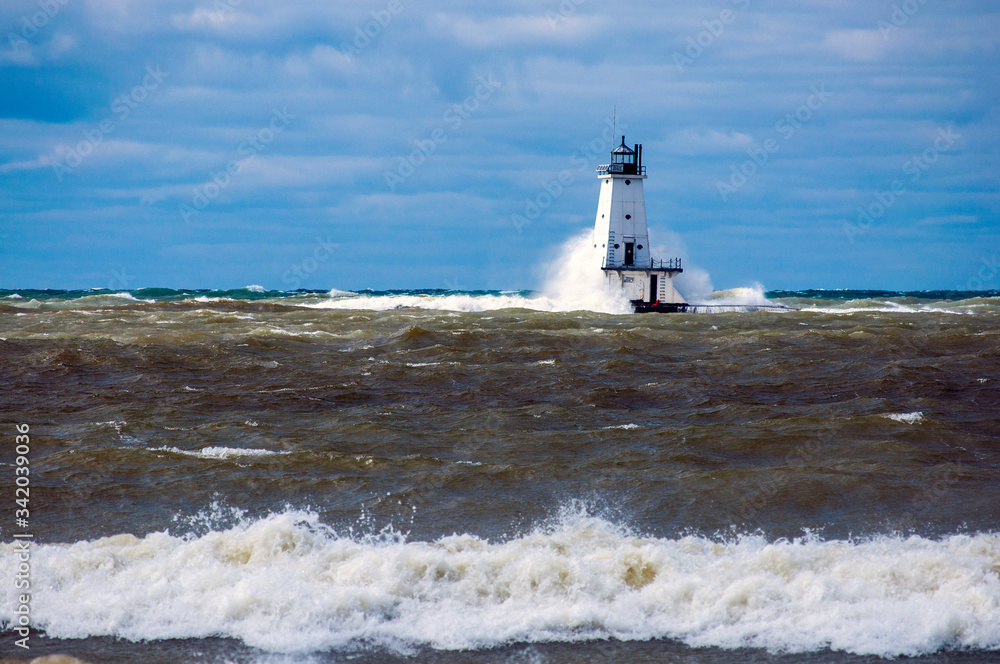lighthouse with heavy waves