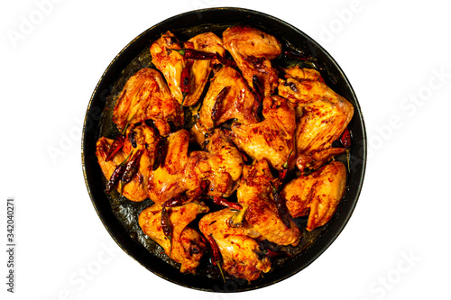 Plate of delicious barbecue chicken wings, top view, isolated, junk food concept