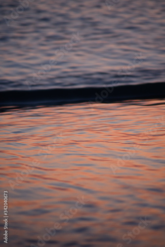 Mirror sunset sky in the water. Sunset sea. Gradient wallpaper. 