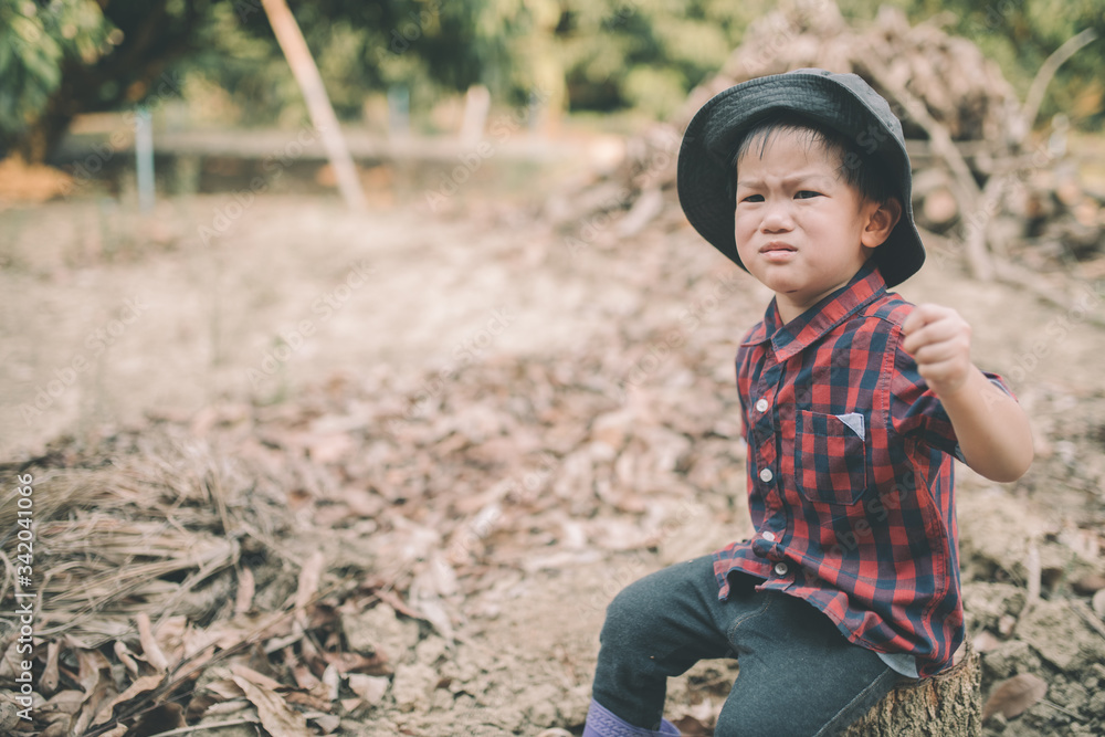 Cute little Asian children wearing red shirts are sad and cry. Cute little Asian children wearing red shirts are sad and cry.