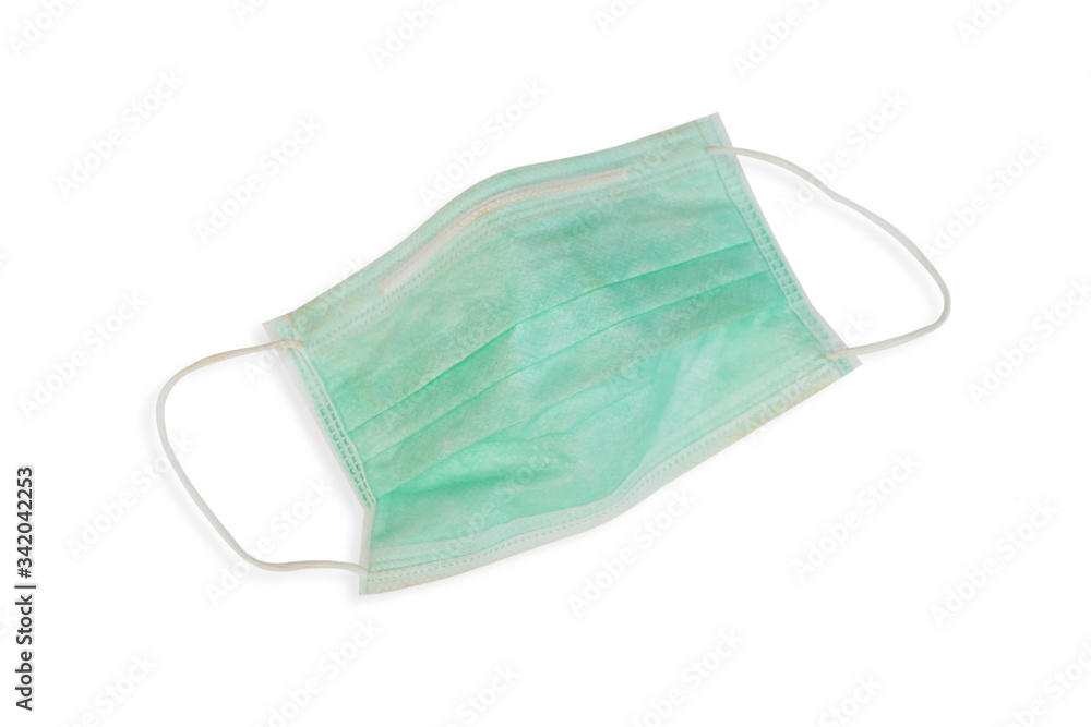 Medical mask isolated on white background. Green disposable independent protective mask or dust mask for healthy and anti virus background. Medical mask isolated on white background. Green disposable independent protective mask or dust mask for healthy and anti virus background.
