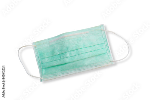 Medical mask isolated on white background. Green disposable independent protective mask or dust mask for healthy and anti virus background.
