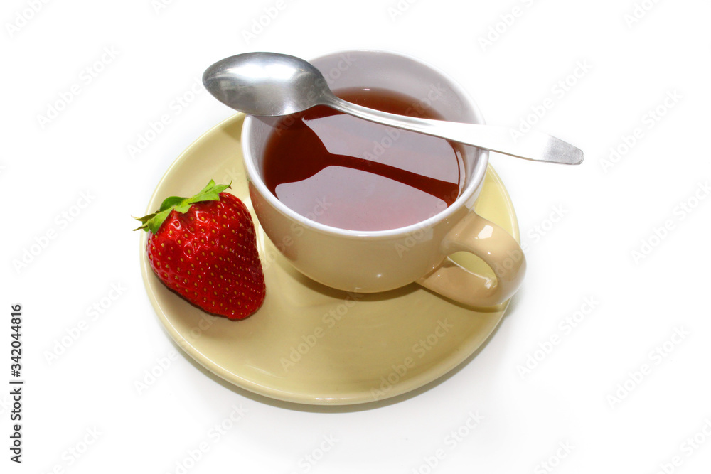 Ripe strawberries and a beige clay cup isolated on a white background. Ripe strawberries and a beige clay cup isolated on a white background.