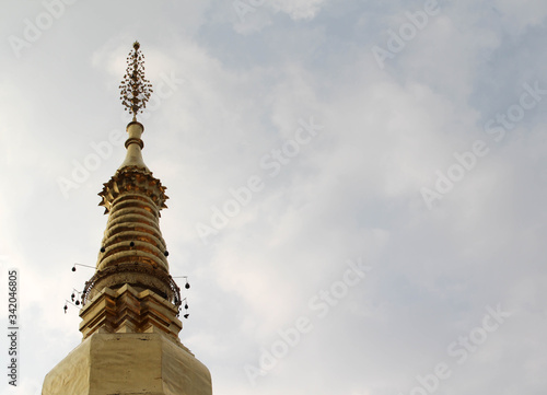 The golden chedi in Wat Phra That Chohae in Phrae province, Northern Thailand. photo