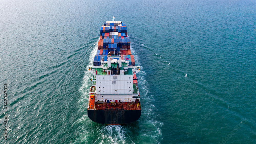 Fototapeta premium Aerial view container cargo ship, import export commerce global business trade logistic and transportation of worldwide by container cargo ship boat in the open sea, Freight shipping maritime.