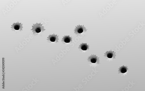 Realistic gun bullet holes set on grey metal wall