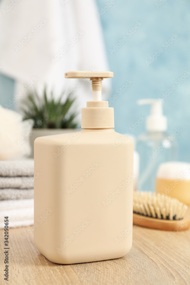 Bottle for liquid soap on wooden table. Personal hygiene concept Bottle for liquid soap on wooden table. Personal hygiene concept