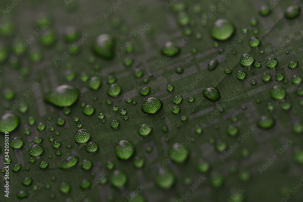 Water drops on a waterproof fabric. ( Water droplets on the tent fabric. ) Water drops on a waterproof fabric. ( Water droplets on the tent fabric. )